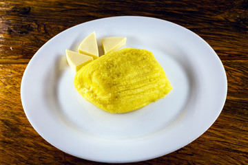 Pamonha, Brazilian sweet corn with cheese filling. Pamonha typical of Brazil, food of the state of minas gerais and goiais. Concept of traditional food. Brazilian food