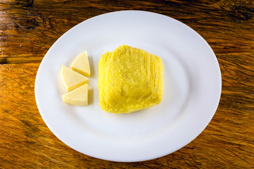 Pamonha, Brazilian sweet corn with cheese filling. Pamonha typical of Brazil, food of the state of minas gerais. Concept of traditional food. Brazilian food at rural parties in June and July.