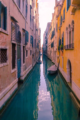 Fototapeta na wymiar Narrow empty street canal in Venice.