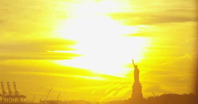Bright New York Sunset With The Classic Statue Of Liberty Reflecting On Iconic Hudson River In The Famous Beautiful New York City