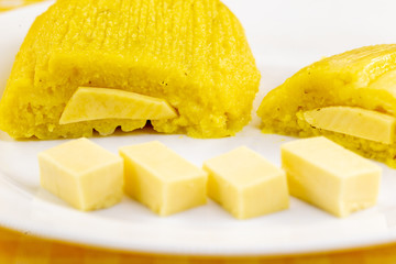 pamonha, Brazilian sweet made from homemade cheese with corn. Open pissing ready for consumption. Concept of traditional Brazilian sweet, typical food of the months of June and July.