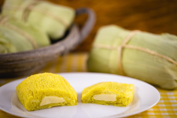 pamonha, Brazilian sweet made from homemade cheese with corn. Open pissing ready for consumption. Concept of traditional Brazilian sweet, typical food of the months of June and July.