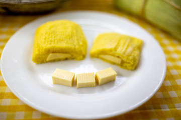 pamonha, Brazilian sweet made from homemade cheese with corn. Open pissing ready for consumption. Concept of traditional Brazilian sweet, typical food of the months of June and July.
