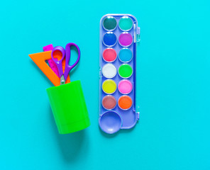 Stationery flat lay.Paints and brushes for creativity. Back to school.