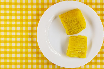 pamonha, Brazilian sweet made from homemade cheese with corn. Open pissing ready for consumption. Concept of traditional Brazilian sweet, typical food of the months of June and July.