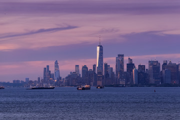 Fototapeta na wymiar New York City Manhattan skyline at dusk after sunset, view from New York Bay, water view