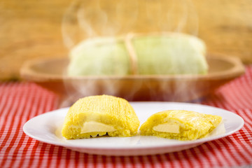 Pamonha, Brazilian sweet corn with cheese filling. Pamonha typical of Brazil, food of the state of minas gerais. Concept of traditional food. Brazilian food at rural parties in June and July.