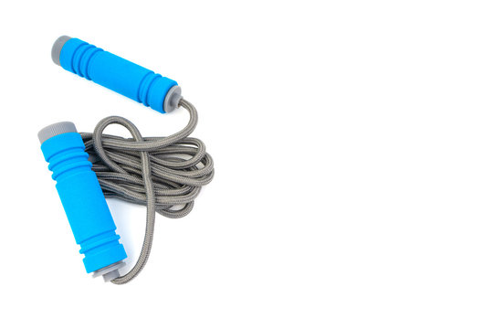 Skipping rope or jumping rope isolated on white background. Selective focus and crop fragment