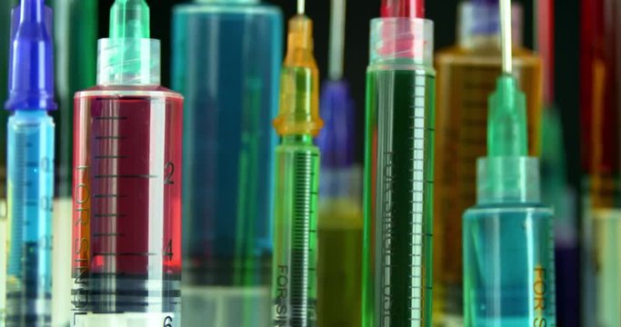 Rows of bright and colorful syringes