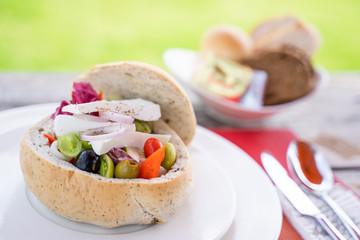 greek salad in bread cup