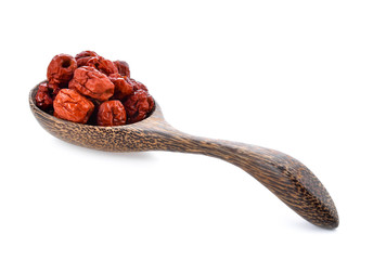 Chinese jujube isolated In wooden spoon on white background