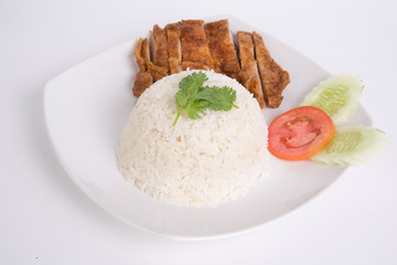 Vegetables and Grilled chicken breasts with thai jasmine rice in white dish isolated on white background. Thai style Food.