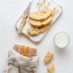 Homemade bread stored in a reusable linen bag with drawstring. Eco friendly Zero waste concept.