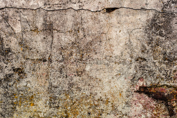 Texture of a concrete wall with cracks and scratches which can be used as a background
