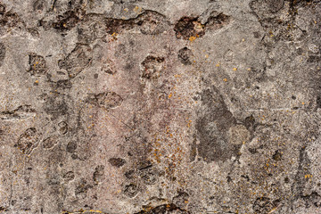 Texture of a concrete wall with cracks and scratches which can be used as a background