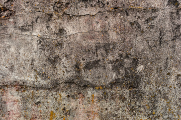 Texture of a concrete wall with cracks and scratches which can be used as a background