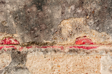 Texture of a concrete wall with cracks and scratches which can be used as a background