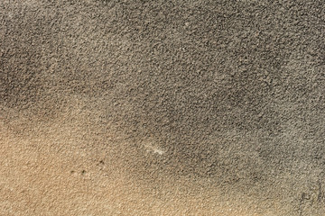 Texture of a concrete wall with cracks and scratches which can be used as a background