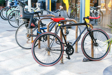 Fototapeta na wymiar Bicycle parking supermarket or office, Europe. Urban transport concept.