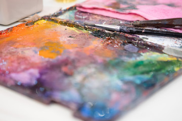 Obraz premium Selective focus of Oil paint and brush