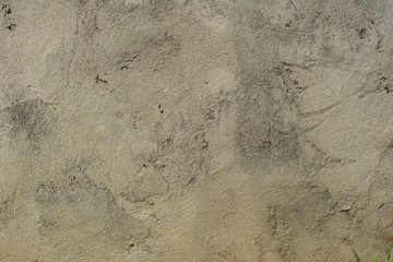 Texture of a concrete wall with cracks and scratches which can be used as a background