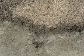 Texture of a concrete wall with cracks and scratches which can be used as a background