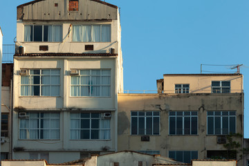 Architectural detail of facades of residential buildings at the Copacabana beach boulevard with weathered exteriors