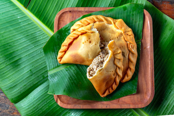 Easter Island Tuna empanadas on banana palm tree leaves. Top view