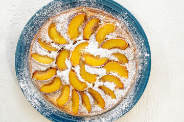 Peach Cake, Homemade Dessert with Fresh Fruits Close Up on White Background, Top View