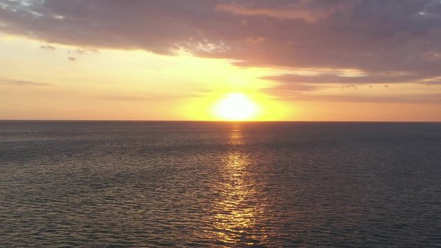 Beautiful sunset in Bali. Kuta beach aerial view. Aerial video from the drone.