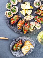 Seafood assorted platter Macha and mussels a la parmesana, mussels a la chalaca, clams with herb sauce