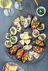 Seafood assorted platter Macha and mussels a la parmesana, mussels a la chalaca, clams with herb sauce
