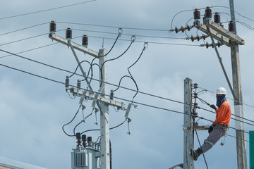 Electricians repairing,electricians repairing wire on electric power pole, power linesman climb the...