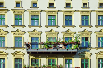 Facade of a green renovated old apartment buildings seen in Berlin, Germany