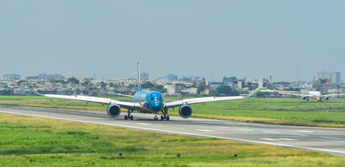 Airplane taxiing on runway of the airport