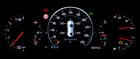 Fototapeta premium TPMS (Tyre Pressure Monitoring System) monitoring display on car dashboard panel. The pressure measurement given in kilopascal (kPa). Malfunction or check engine warning light control on car dashboard