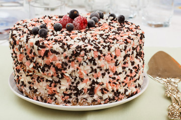 Homemade chocolate cake decorated with fresh berries.