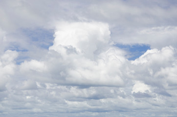 Blue sky and white clouds with blurred background patterns