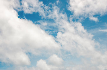 Blue sky and white clouds with blurred background patterns