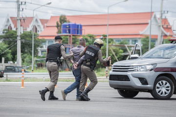 Obraz premium Police steel handcuffs,Police arrested the culprit,criminal,Arrest the culprit,Police concept.