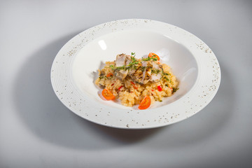 Risotto With Chicken Breast Pieces And Cherry Tomatoes