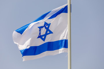 Flag of Israel at morning sky