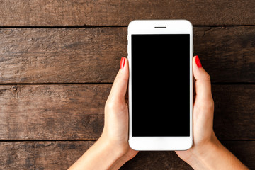 Woman using smartphone. Top view