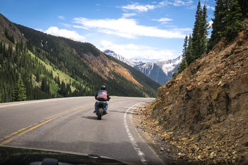 Fototapeta na wymiar Motorcyclist in American Flag leather jacket - Ouray, Colorado