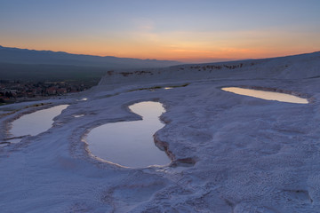 Carbonate travertines the natural pools during sunset, Pamukkale, Turkey