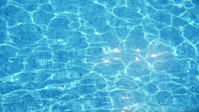 Fresh turquoise waters in a swimming pond in Alanya in summer in slo-mo 