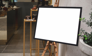 Mockup billboards or white promotion poster displayed on the front of the restaurant, coffee shop Promotion information for marketing announcements and details