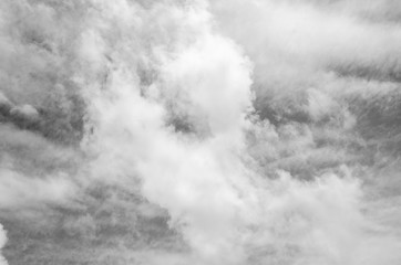 Fototapeta na wymiar Gray sky with white clouds with blurred pattern background