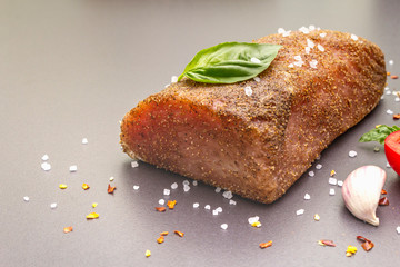 Raw pork loin with vegetables, species and herbs