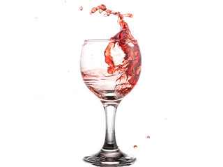 Red wine splash in a round glass on a white background